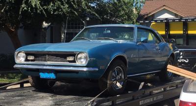 Camaro on flatbed cropped plate blurred