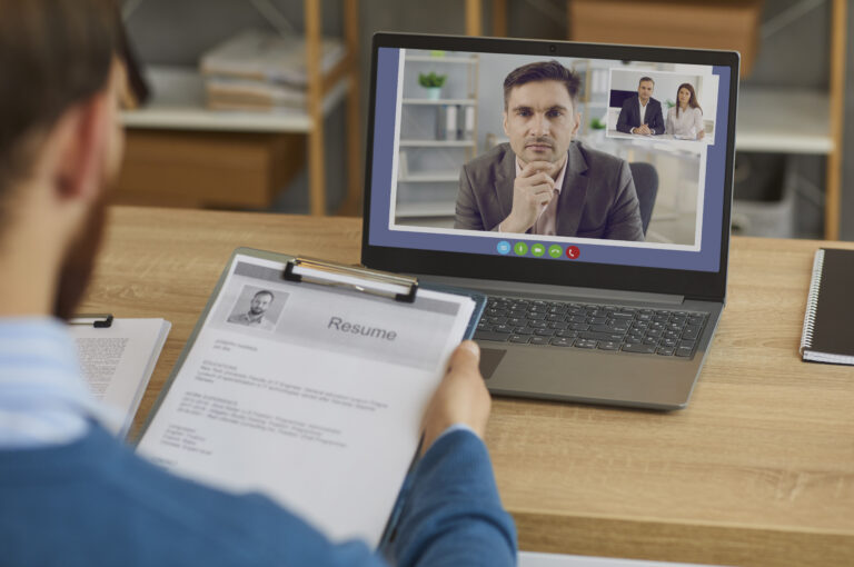 Serious Employer Or Personnel Recruiter Listening To Candidate In Online Job Interview