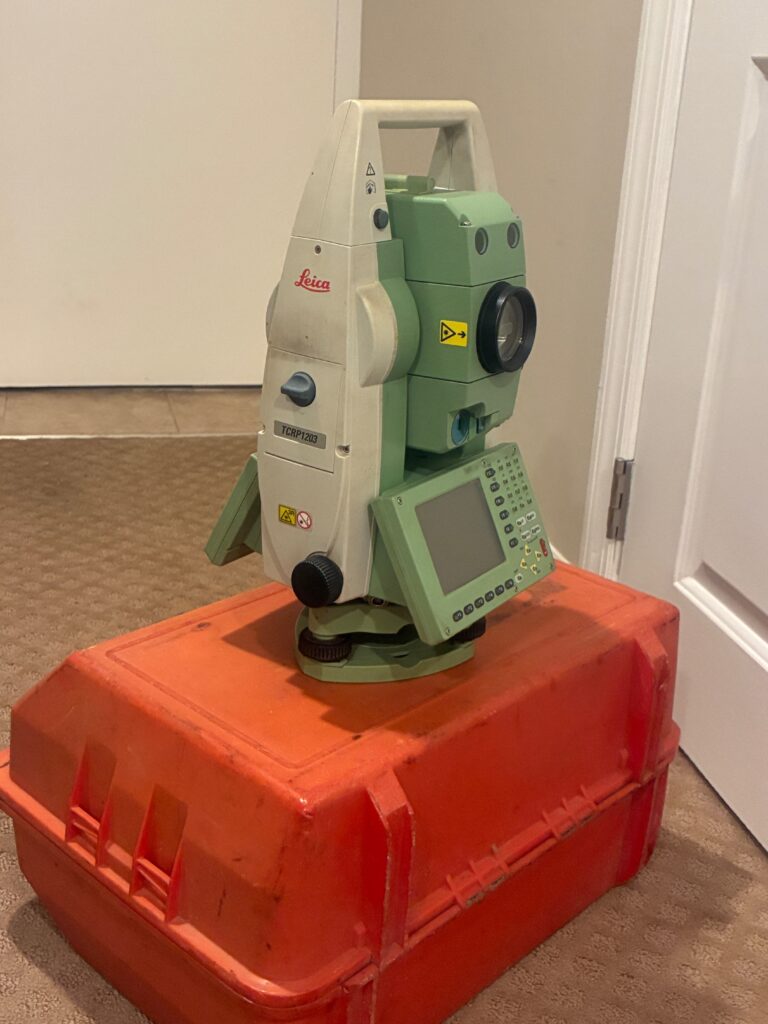 Leica total station instrument used in land surveying and geomatics.