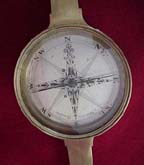 Antique surveyor compass used in land surveying and geomatics.